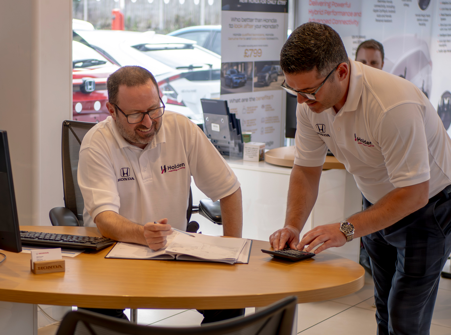Two Holden Employees talking