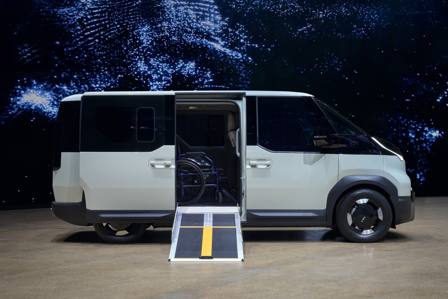 Wheelchair accessible vehicle with a side tramp. The ramp is lowered to show how it would look in use.